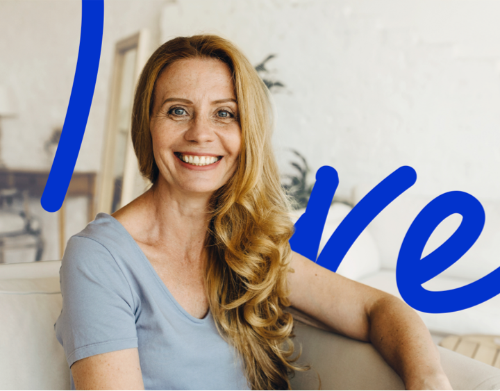 Women sitting on couch smiling